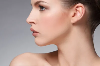 Woman with a sculpted, defined jawline after Kybella double chin treatment at Touch and Glow Med Spa in Glendale, AZ.